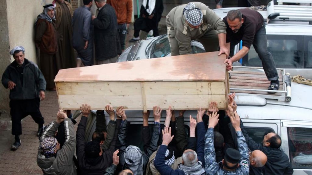 Mourners carry the coffin of a soldier, who was killed during clashes in Falluja, at his funeral in Najaf, 160 km  south of Baghdad today. Photograph: Reuters