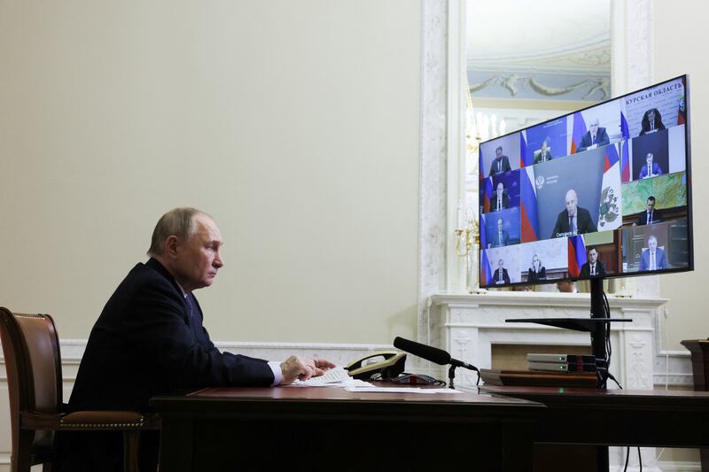 Vladimir Putin chairs a meeting with members of his government via videoconference, at the Constantine Palace in Strelna, St Petersburg, on Tuesday. Photograph: Mikhail Metzel/AFP via Getty Images