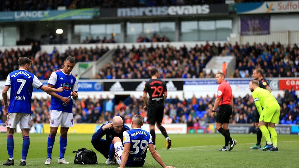 Ireland’s Jonathan Walters of Ipswich Town receives treatment before leaving the field injured during their Championship clash with Bolton. Photo: Stephen Pond/Getty Images