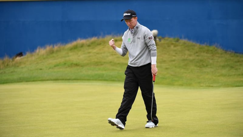 Ireland’s Gavin Moynihan  reacts to a putt on the 18th green during the final round of the Dubai Duty Free Irish Open at Portstewart Golf Club. Photograph: Ross Kinnaird/Getty Images