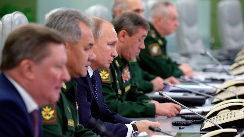 Russian president Vladimir Putin is flanked by top military and civilian personnel at the defence ministry in preparatiuon for Avangard’s launch. Photograph: Mikhail Klimentyev, Sputnik, Kremlin Pool/ via AP