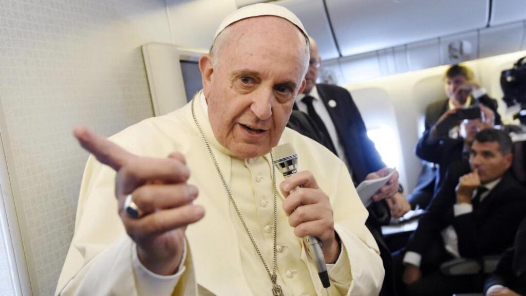 Pope Francis gestures while speaking to journalists aboard the flight from South Korea to Italy on Monday. Photograph: Daniel Dal Zennaro/EPA