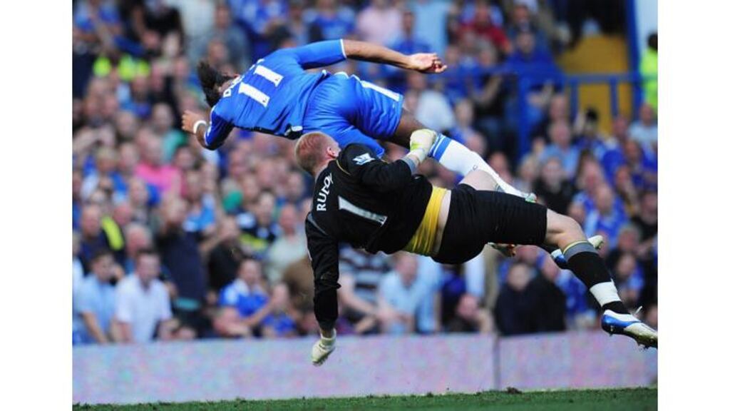 Goalkeeper John Ruddy of Norwich City collides with Didier Drogba of Chelsea at Stamford Bridge. The latter was knocked out by the clash. - (Photograph: Shaun Botterill/Getty Images)
