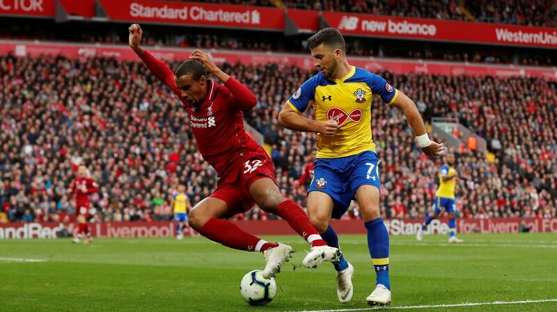 Shane Long presses Joel Matip during Southampton’s 3-0 defeat at Anfield. Photograph: Lee Smith/Reuters