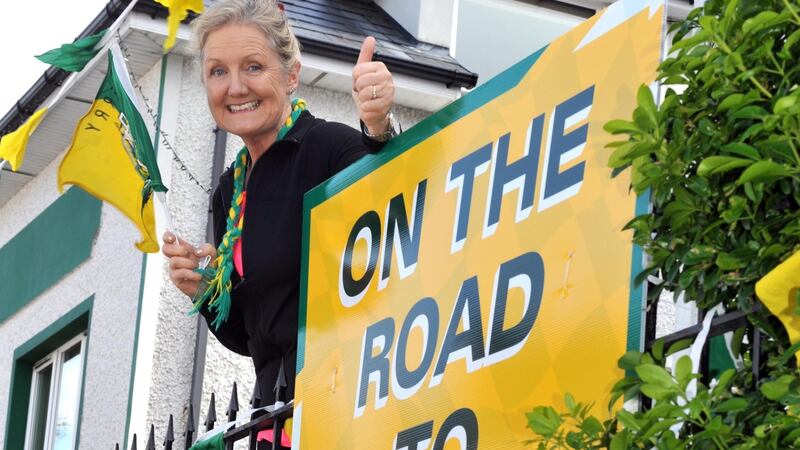Mary O’Brien, mother of Kerry forward and player of the year contender Stephen, proudly displays the county colours at her home in Kenmare, Co Kerry. Photo: Don MacMonagle