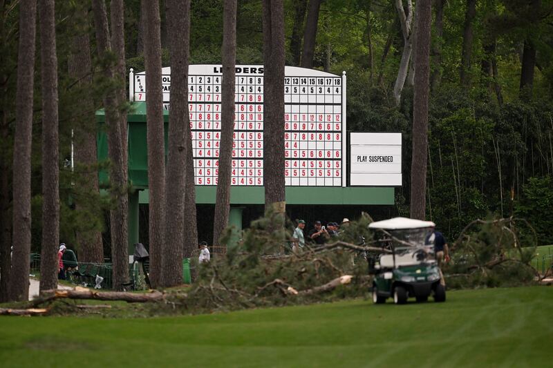 Signage saying 'Play Suspended' on the leaderboard due to fallen trees on the 17th hole during the second round of the 2023 Masters. Photograph: Ross Kinnaird/Getty Images