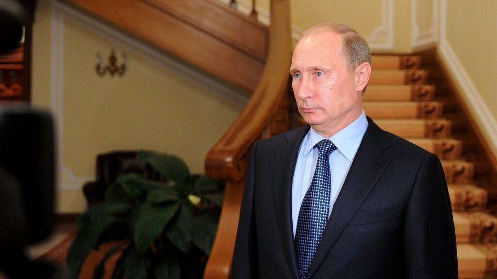 Russia’s president Vladimir Putin makes a statement on issues connected with chemical weapons in Syria at the Novo-Ogaryovo residence outside Moscow. Photograph: Michael Klimentyev/RIA/Novosti/Reuters