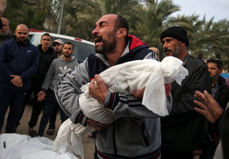 A man cradles the body of a child killed in an Israeli air strike during a funeral in Khan Younis, in southern Gaza, on November 22nd. Photograph: Yousef Masoud/New York Times