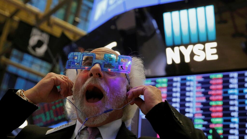 New York Stock Exchange trader Peter Tuchman, a familiar face in the financial media, dons his 2018 glasses as he sees out the old year. Photograph: Andrew Kelly / Reuters