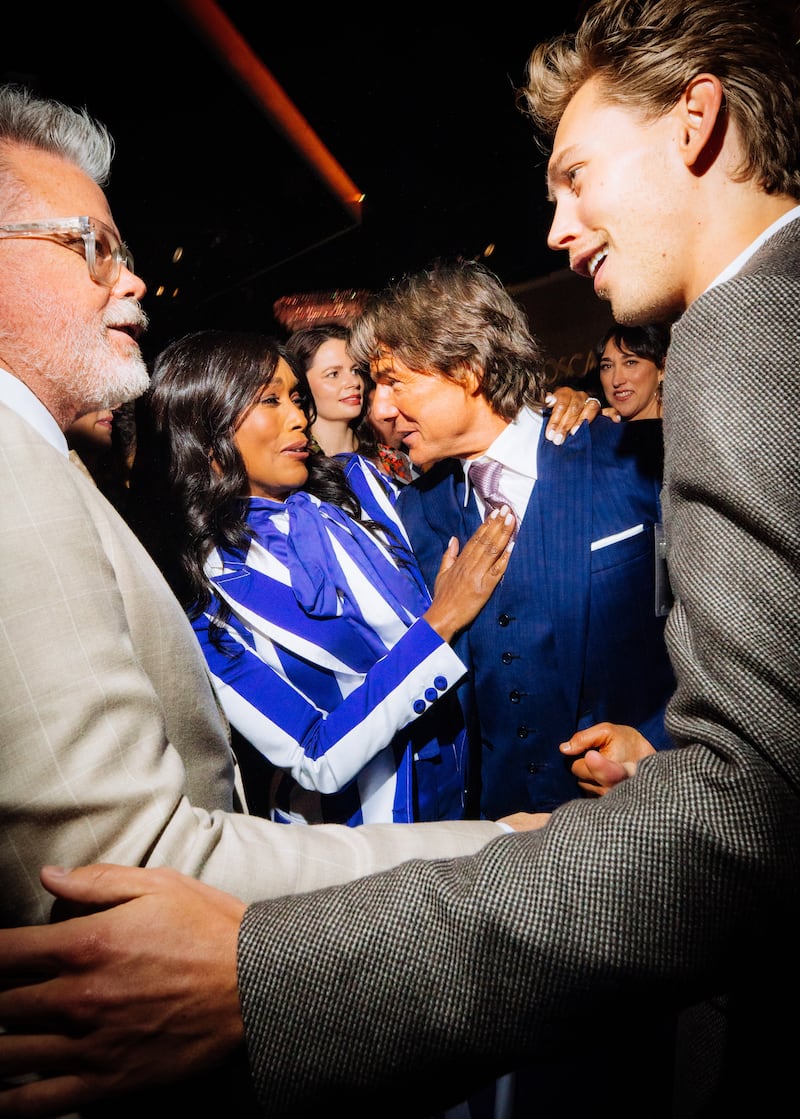 Black Panther star Angela Bassett with Tom Cruise while Top Gun: Maverick screenwriter Christopher McQuarrie and Austin Butler chat. Photograph: Sinna Nasseri for The New York Times