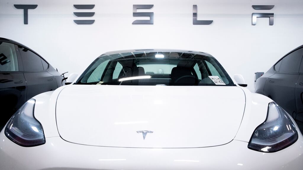 A Tesla Model 3 used by a dealership as a test-drive vehicle is seen parked in a garage in Washington, DC. Tesla sales in China rose in June. Photograph: EPA/MICHAEL REYNOLDS