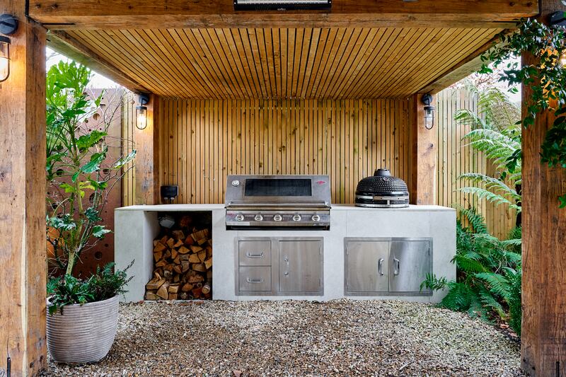 Large Signature barbecue and a charcoal-burning Kamado Joe ceramic egg