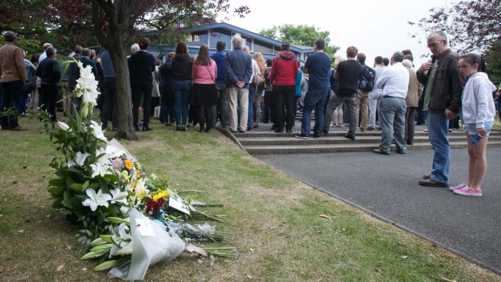 ‘Communities come into their own, like schools, which continue to have deep significance long after pupils have left them behind, and parishes, which open their doors to create a safe space to gather.’ Above, flowers have been laid beside a memorial service in UCD, Dublin for the six students who died in the balcony collapse tragedy in Berkeley, California. Photo: Gareth Chaney Collins