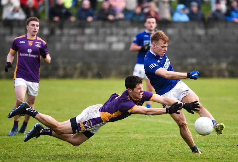 Rory O’Carroll of Kilmacud Crokes attempts to block Ardee St Mary's Ciarán Keenan. Photograph: Ciarán Culligan/Inpho