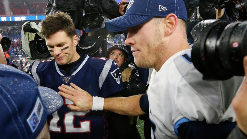 New England Patriots quarterback Tom Brady gets a pat on the chest from his Tennessee Titans counterpart Ryan Tannehill after their AFC wildcard playoff game at Gillette Stadium in Foxborough, Massachusetts. Photograph: CJ Gunther/EPA