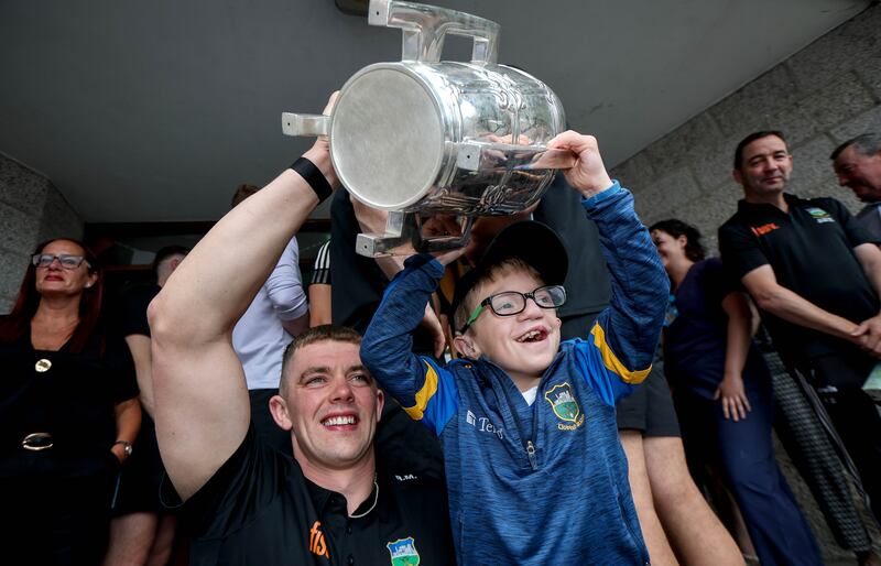 Tipperary hurling captain Ronan Maher with Oisín Crowe during the All-Ireland champions' visit to Children's Health Ireland at Crumlin today. Photograph: Ryan Byrne/Inpho