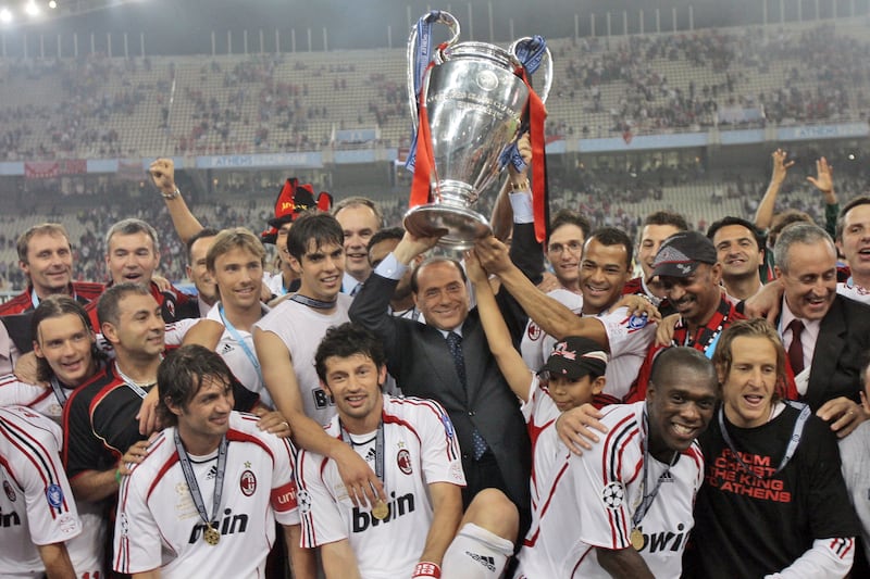 Silvio Berlusconi with AC Milan players. File photograph: Luca Bruno/AP