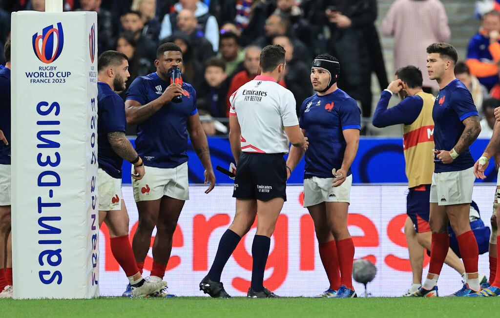France’s Antoine Dupont talks to referee Ben O'Keeffe during the quarter-final defeat to South Africa at the Stade de France, St Denis Paris. Photograph: Stickland/Inpho