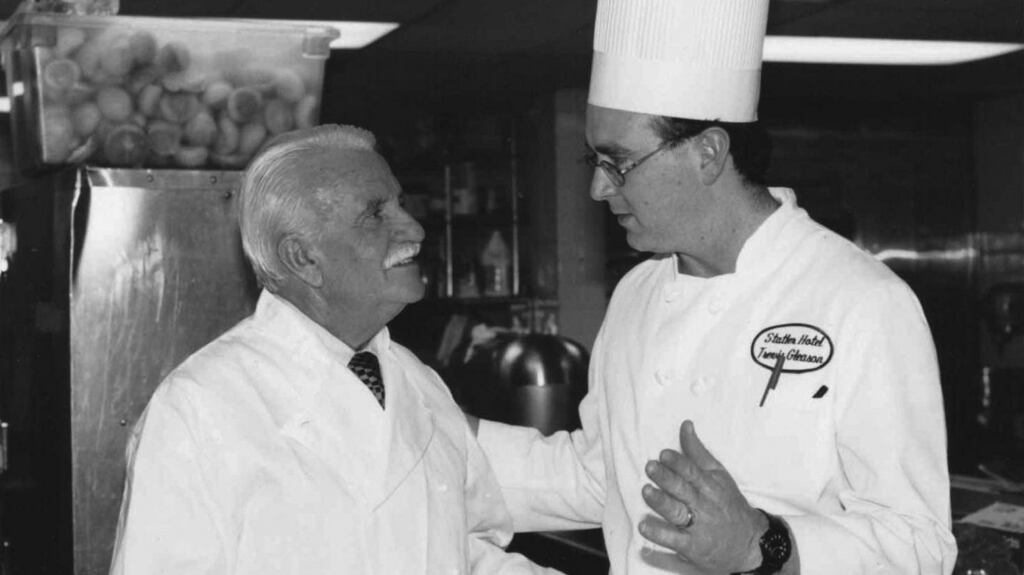 Trevis Gleason, right, with chef Roger Vergé at Cornell University’s School of Hotel Administration, 1996