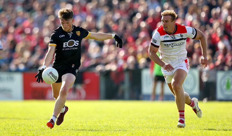 Down’s Miceal Rooney and Louth's Conor Grimes. Photograph: Ryan Byrne/Inpho