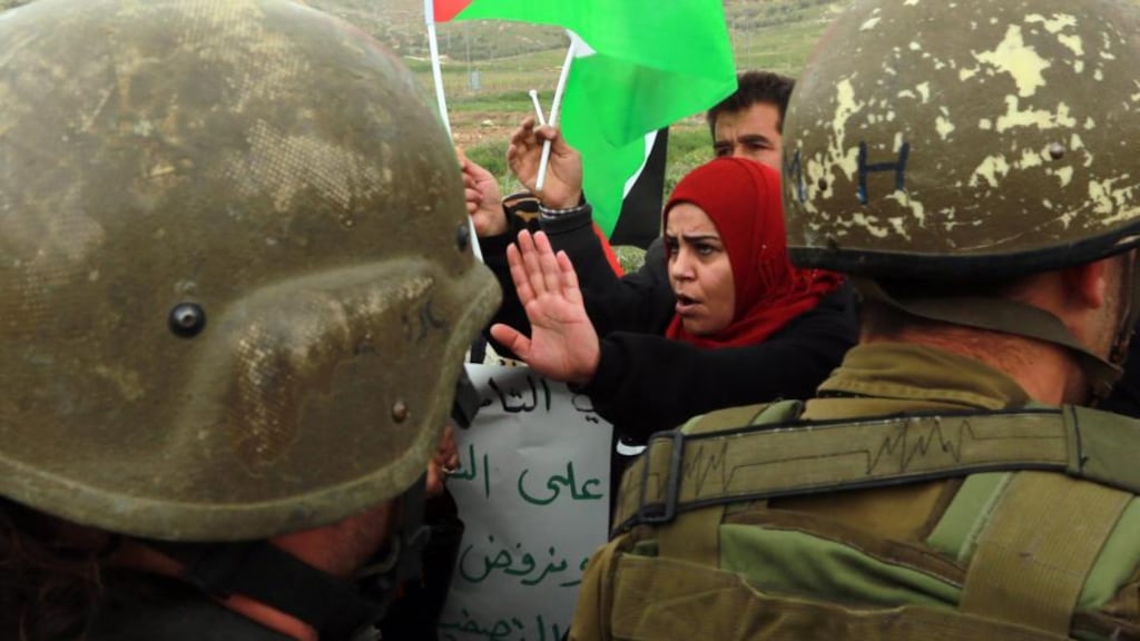Supporters of the Union Of Palestinian Women Committees argue with Israeli solders during a protest at the Howara checkpoint near Nablus in the West Bank on Saturday. Photograph: EPA/Alaa Badarneh
