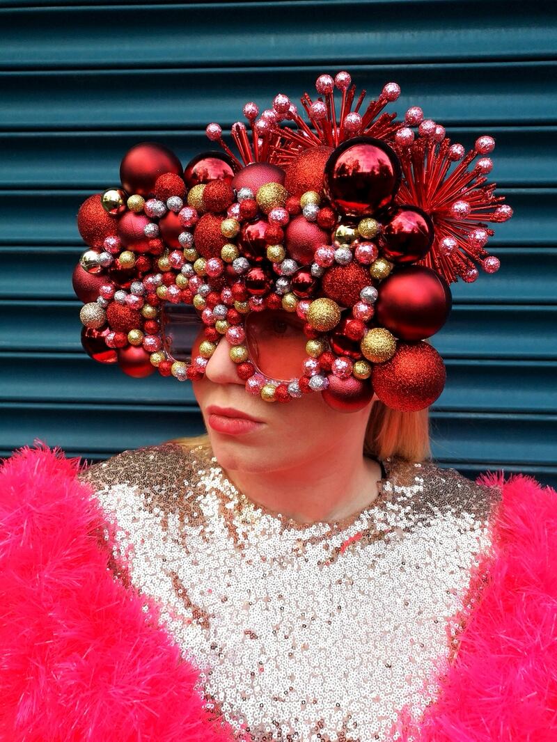 Bauble Collective – an old jumper decorated with more than 150 baubles and then trimmed with neol tinsel and sequins. Eyewear made by layering various baubles around the lenses.