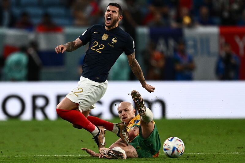 France's Theo Hernandez is tackled by Australia's Aaron Mooy during Group D match at the Al-Janoub Stadium. Photograph: Jewel Samad/AFP via Getty Images