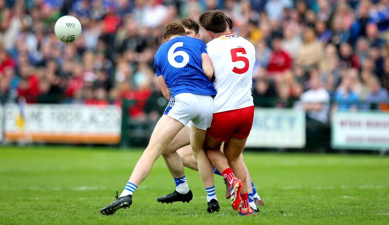 Cavan’s Ciarán Brady goes shoulder-to-shoulder with Michael McKernan of Tyrone. Photograph: Ryan Byrne/Inpho