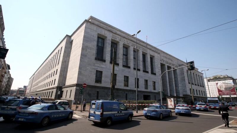 Police cars surround the court in Milan. Photograph: Stefano Rellandini/Reuters