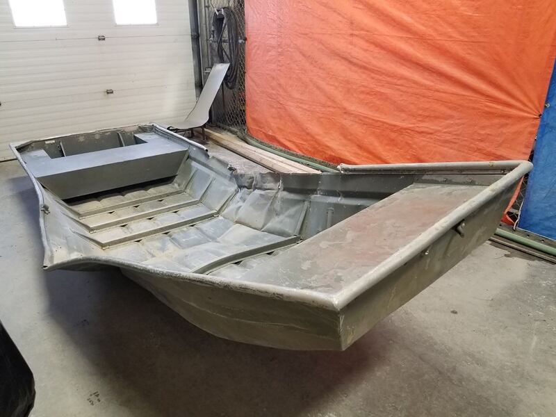 A damaged aluminum boat, recovered from the shores of the Nelson River by Royal Canadian Mounted Police while searching for Mr McLeod and Mr Schmegelsky, is seen in Sundance, Manitoba, Canada on August 4th. Photograph: Manitoba RCMP/Handout/Reuters