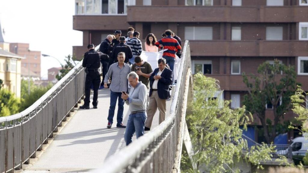 Police officers investigate the scene of a shooting after President of Leon’s regional government Isabel Carrasco was shot in Leon, northern Spain. Photograph: Javier Casares/EPA