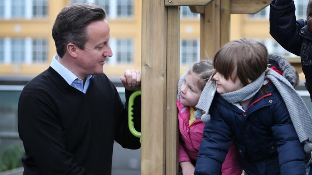Children look at Britain’s prime minister David Cameron during visit to the Coin Street nursery in London today. Britain’s coalition government unveiled a larger-than-expected scheme to help cut the cost of childcare for working parents. Photograph: Peter Macdia/Reuters
