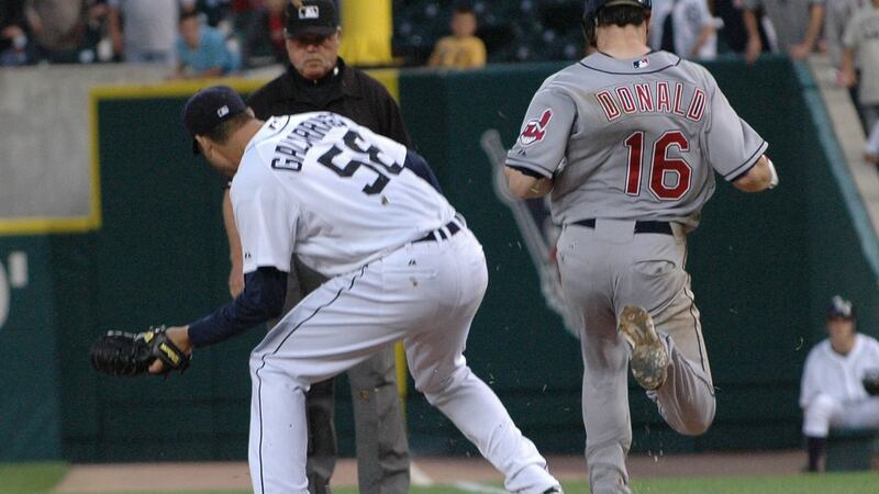 Pitcher Armando Galarraga No 58 of the Detroit Tigers covers first base as Jason Donald NO 16 of the Cleveland Indians steps on the bag while umpire Jim Joyce watches on.  Donald was called safe by Joyce, in what would have been the last out of a perfect game thrown by Galarraga. Photo:  Bill Eisner/Detroit Tigers/Getty Images