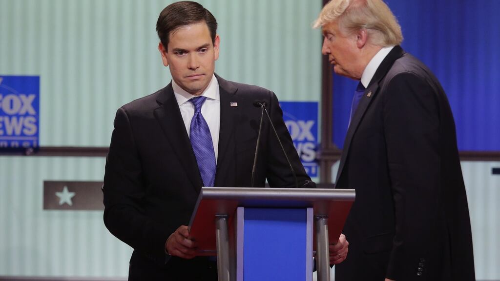 Marco Rubio and Donald Trump: Trump retweeted a photo posted last week by a supporter mocking the appearance of Rubio’s wife. Photograph: Chip Somodevilla