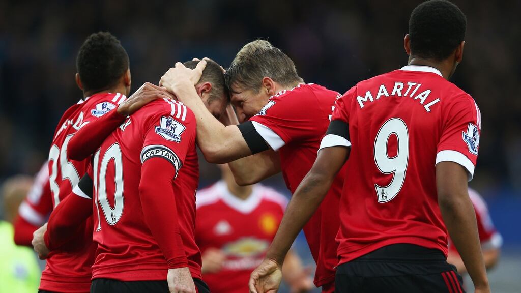 Manchester United celebrate scoring against Everton at Goodison Park. Photograph: Clive Brunskill/Getty Images
