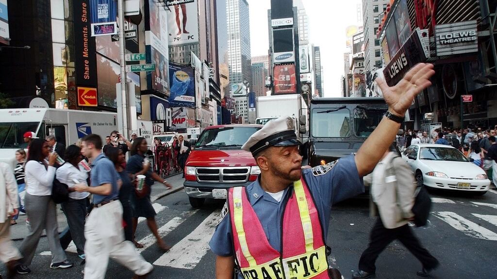 Traffic in Times Square during a massive power outage on August 14th, 2003. The blackout hit US and Canadian cities Thursday, closing nuclear power plants in Ohio and New York state, driving workers in New York City and Toronto into the streets, and shutting subways in blistering heat. Photograph: AP Photo/Gregory Bull