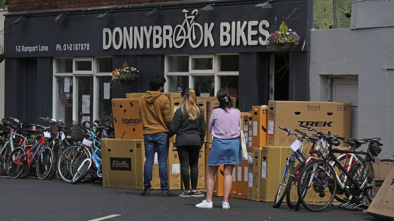 People queue among a delivery of new stock at Donnybrook Bikes. Photograph: Nick Bradshaw/The Irish Times.