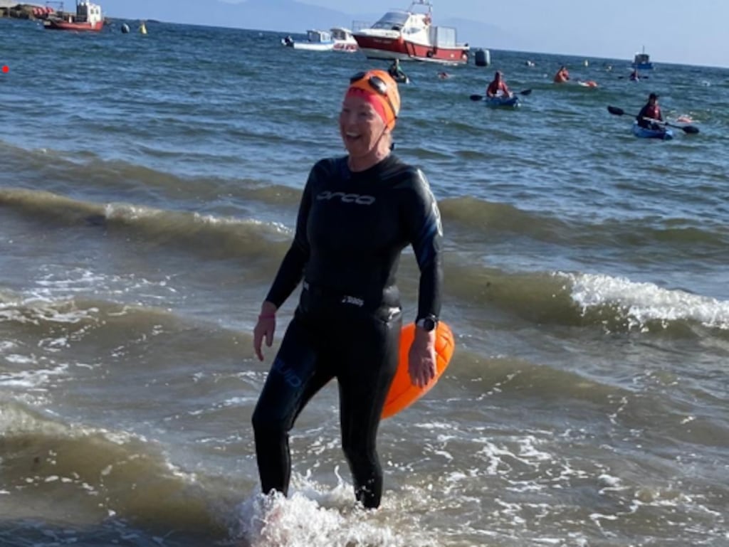 LANDING ON Beach at CLARE ISLAND Ann Ivers walks onto the beach on Clare Island having swum the 5.3km in two hours and ten minutes. Aug 31st 2024...PIC Eugene Ivers