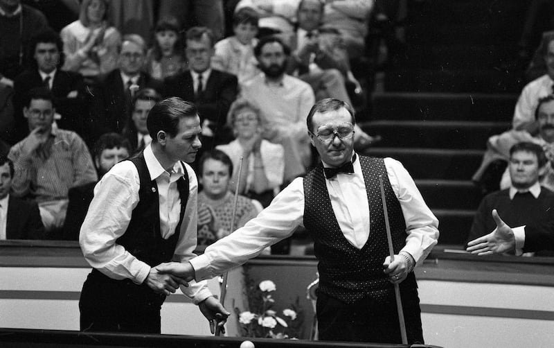 Alex Higgins and Dennis Taylor at the Benson & Hedges quarter-final of the Irish masters in 1990. Photograph: Independent News and Media/Getty Images