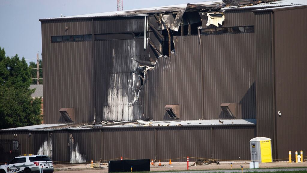 Damage is seen to a hangar after a twin-engine plane crashed into the building at Addison Airport in Addison, Texas on Sunday. Photograph: Shaban Athuman/The Dallas Morning News via AP