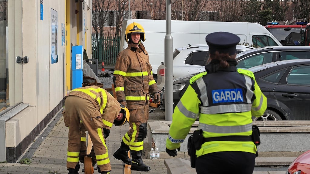 Members of Dublin Fire Brigade and gardaí at the scene of the fire at the Metro Hotel, Ballymun, Dublin,  on Thursday morning. Photograph: Colin Keegan/Collins Dublin