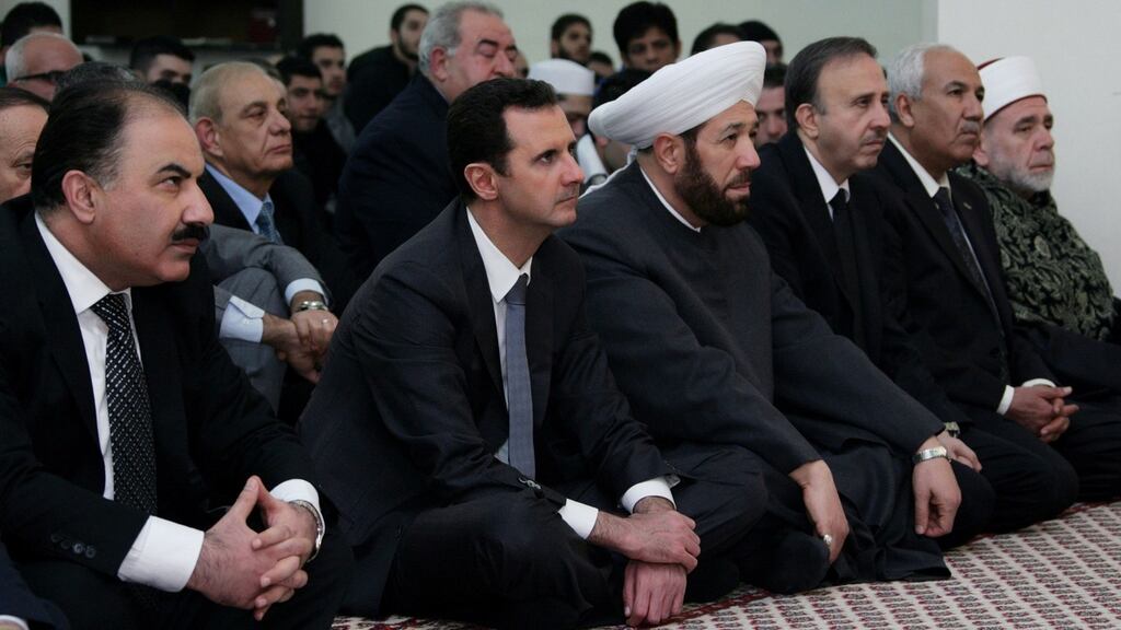 Syria’s president Bashar al-Assad (front 2nd left) attends a religious ceremony on the occasion the Prophet Muhamad’s birthday at al-Hamd mosque in Damascus on January 12th, 2014. Photograph: Sana/Reuters