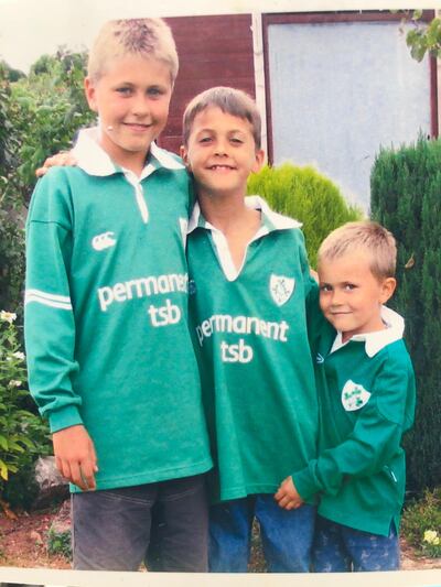 Antoine Frisch (centre) with his older brother Xavier and younger brother Matthew.