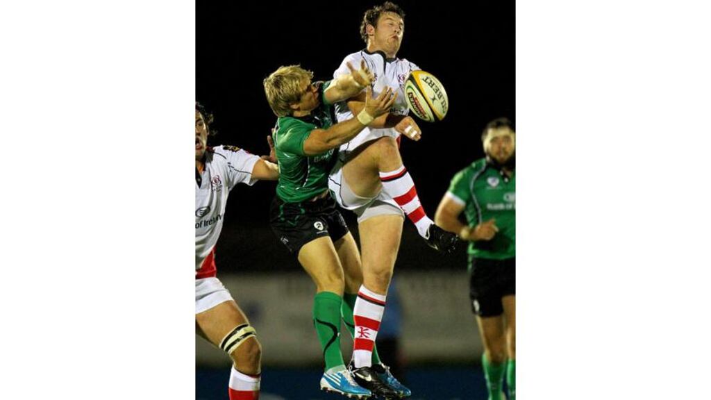 Fionn Carr and Willie Faloon go for the ball during the Magners League game between Connacht and Ulster at the Sportsground in Galway. (Photogrph: Billy Stickland/Inpho)