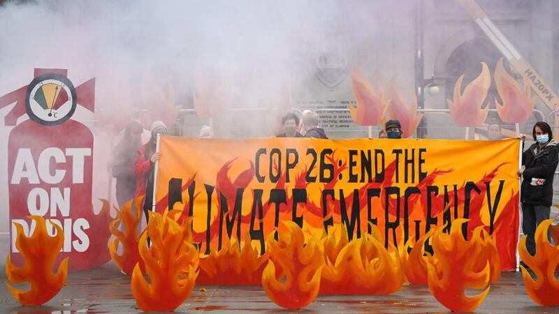 Activists welcome world leaders to Cop26 with a field of climate fire in George Square in Glasgow, Scotland. Photograph: Jeff J Mitchell/ Getty