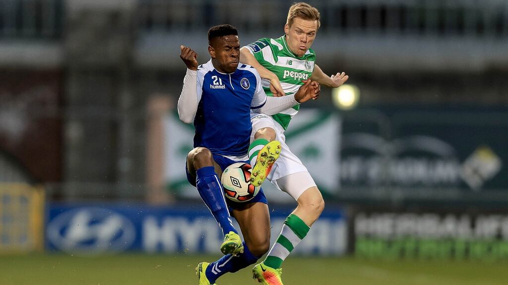 Limerick’s Chiedozie Ogbene with Simon Madden of Shamrock Rovers. Photo: Donall Farmer/Inpho