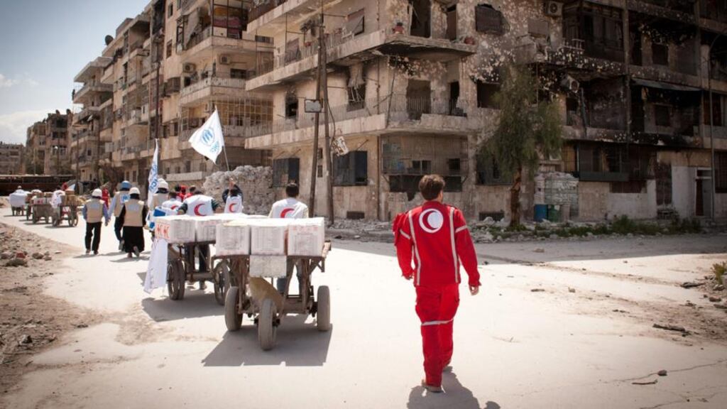 A United Nations High Commissioner for Refugees and Syrian Arab Red Crescent team arrives to the Bustan al-Qasser neighbourhood in Aleppo, which is controlled by opposition forces. Photograph: EPA/UNHCR