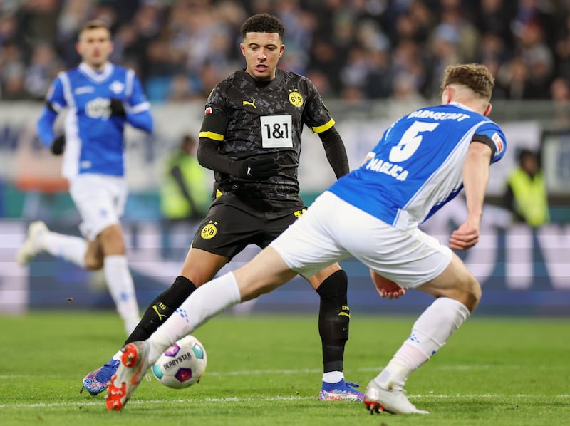 Dortmund's Jadon Sancho in action against SV Darmstadt's Matej Maglica during the Bundesliga clash in Darmstadt, Germany.