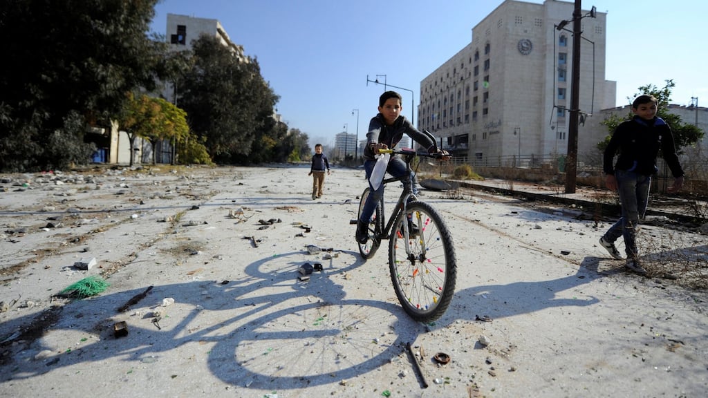 Boys play in Bab al-Faraj square in the government-controlled area of the old dity of Aleppo on Saturday. Photograph: Reuters