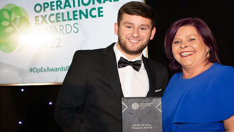 Adam Kane, Senior Sales Executive at Business River, presents the COVID-19 Crisis Response Award to Edith Denieffe, Crane Worldwide Logistics.